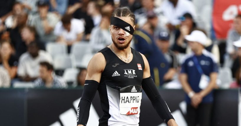 French runner Wilfried Happio wears a bandage after being assaulted at the warm-up stage during in the men's 400 meter hurdles final during the French Elite Athletics Championships at the Helitas stadium in Caen, in northern France.