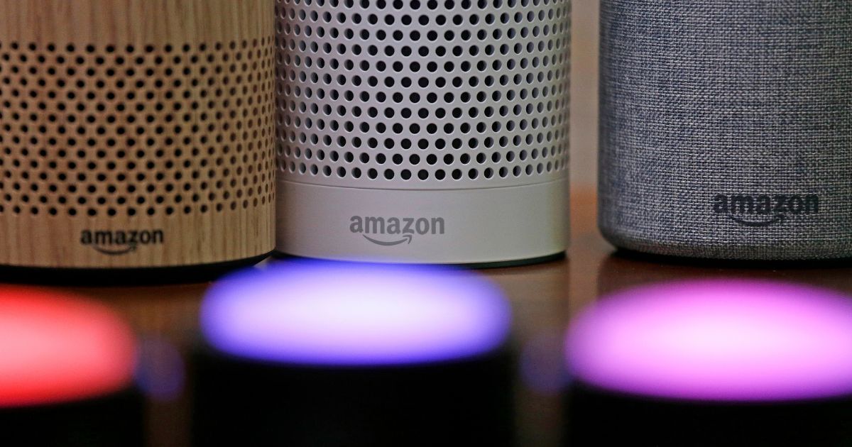 Amazon Echo and Echo Plus devices, pictured most prominently, sit near illuminated Echo Button devices during an event by the company in Seattle in 2017. Amazon’s Alexa can replicate the voice of family members -- even if they’re dead. The capability was unveiled at Amazon’s MARS conference in Las Vegas on June 22, 2022, but it isn't clear if the feature will ever be available to the public.