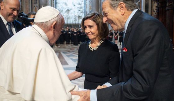 House Speaker Nancy Pelosi and her husband, Paul, greet Pope Francis on Wednesday before Mass at St. Peter's Basilica in Vatican City.