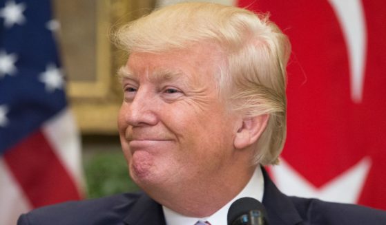 Then-President Donald Trump smiles in the Roosevelt Room of the White House on May 16, 2017, in Washington, D.C.
