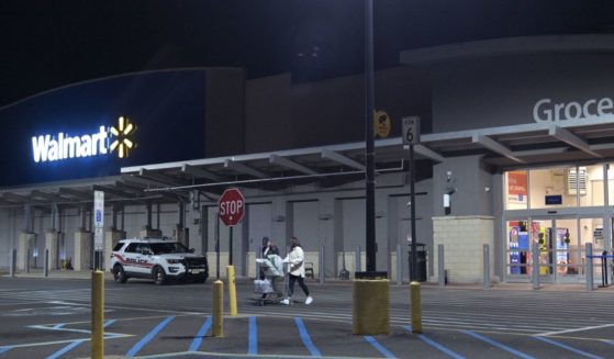 Customers leave a 24-hour Walmart in Neptune City, New Jersey, on Nov. 27, 2020.