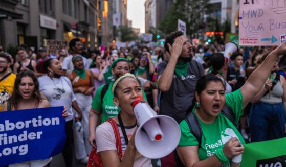 Pro-abortion activists march in New York on Friday.