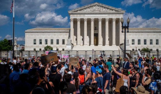 Pro- and anti-abortion demonstrators gather in front of the Supreme Court on Saturday in Washington, D.C.