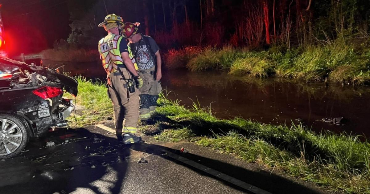 The Crawford Township Volunteer Fire Department helped a tow truck flip the submerged vehicle to free the dog, which survived by finding an air pocket under the dashboard.