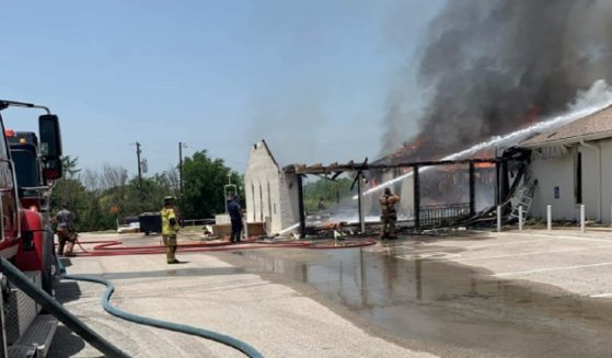 Firefighters battle a blaze at the Balsora Baptist Church in Bridgeport, Texas, on Friday.