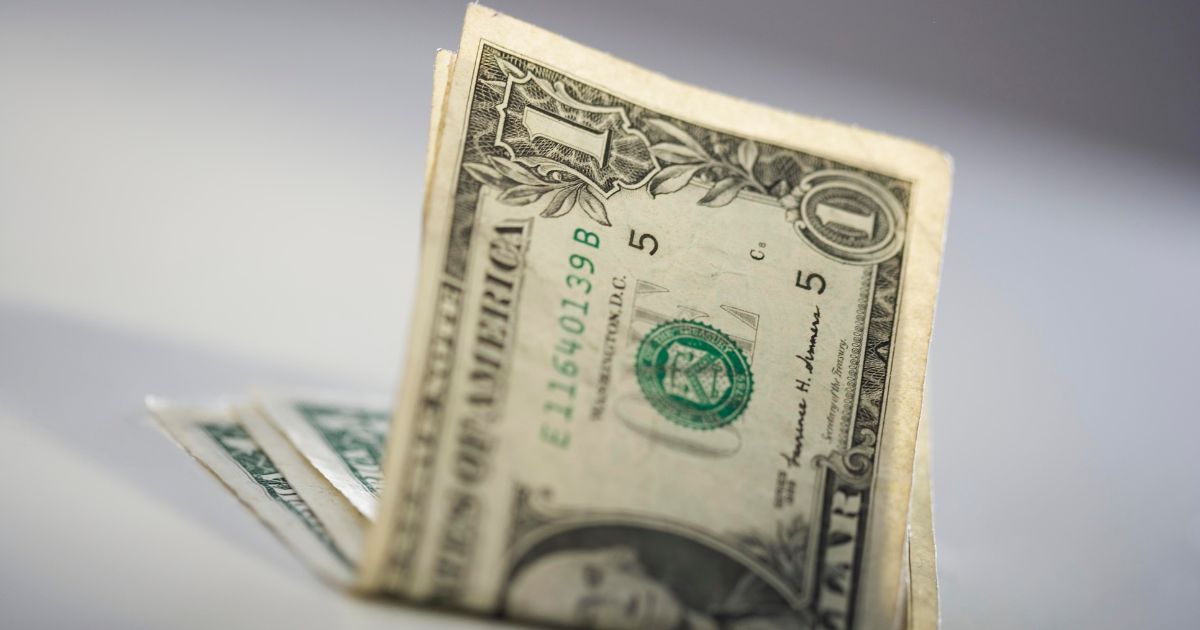 Folded dollar bills are seen in this stock image.