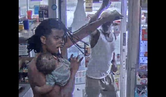 A father with his child fought off a gunman in Detroit on June 19.