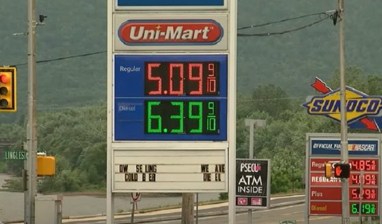 Gas price sign reads $5.09 a gallon for unleaded, $6.39 a gallon for diesel.