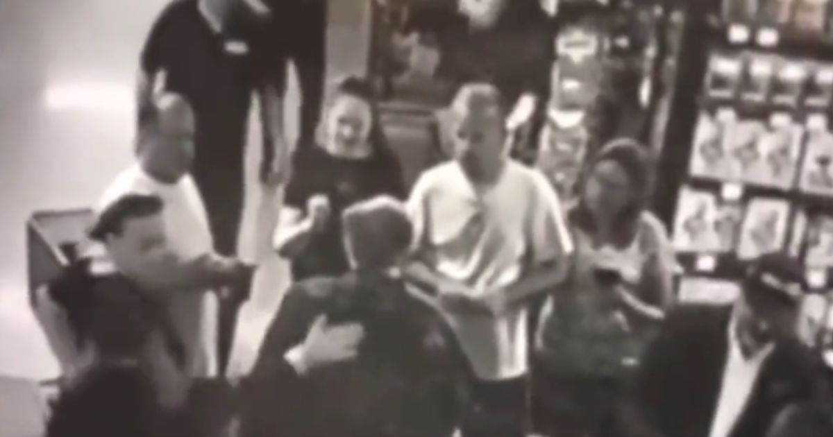 Former New York City Mayor Rudy Giuliani was campaigning on Sunday for his son when a man slapped him on the back.