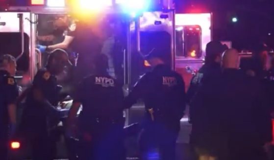 Paramedics on the scene of a shooting Monday in Harlem in New York City that left an aspiring college basketball player dead.