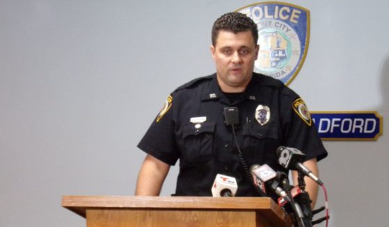 Officer Michal Pietrusinski speaks to reporters at a press conference about his response to the incident.