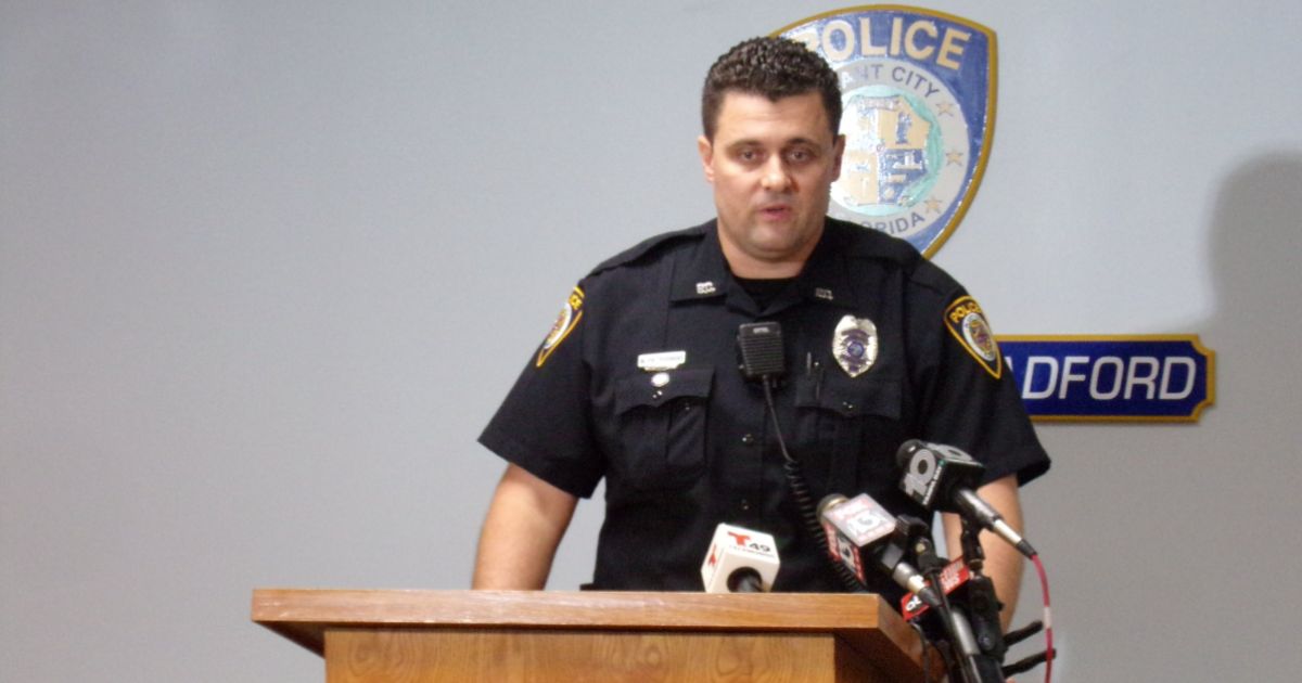 Officer Michal Pietrusinski speaks to reporters at a press conference about his response to the incident.