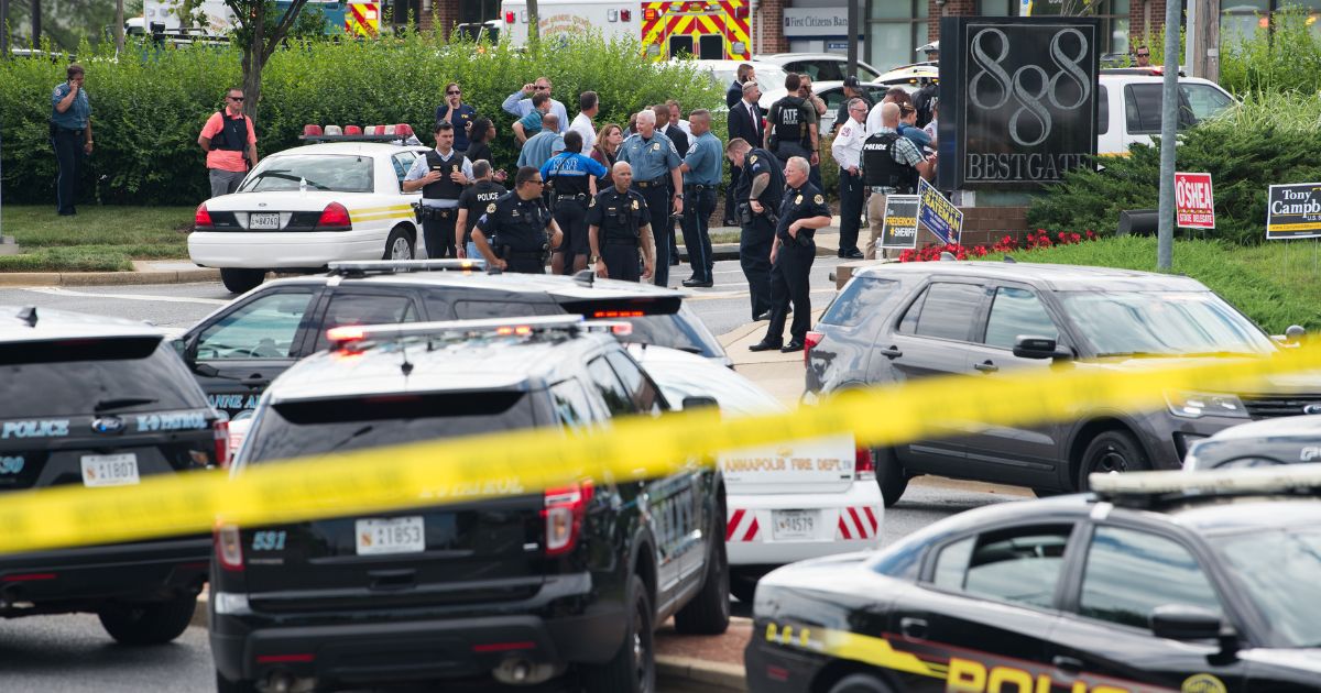 Police gather after responding to a shooting on June 28, 2018, in Annapolis, Maryland.