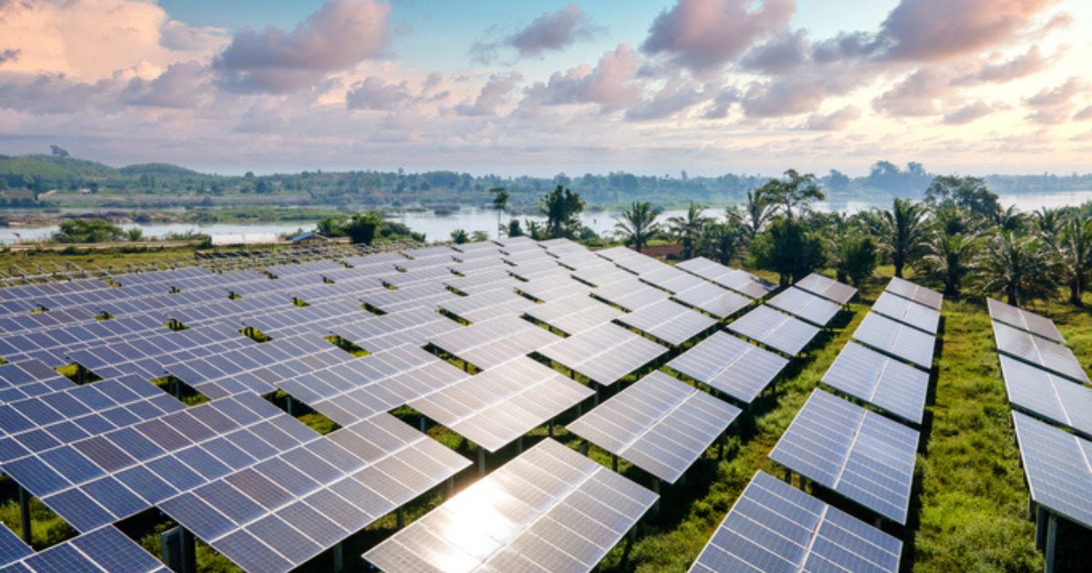 This stock photo shows an aerial view of a field of alternative energy solar panels.
