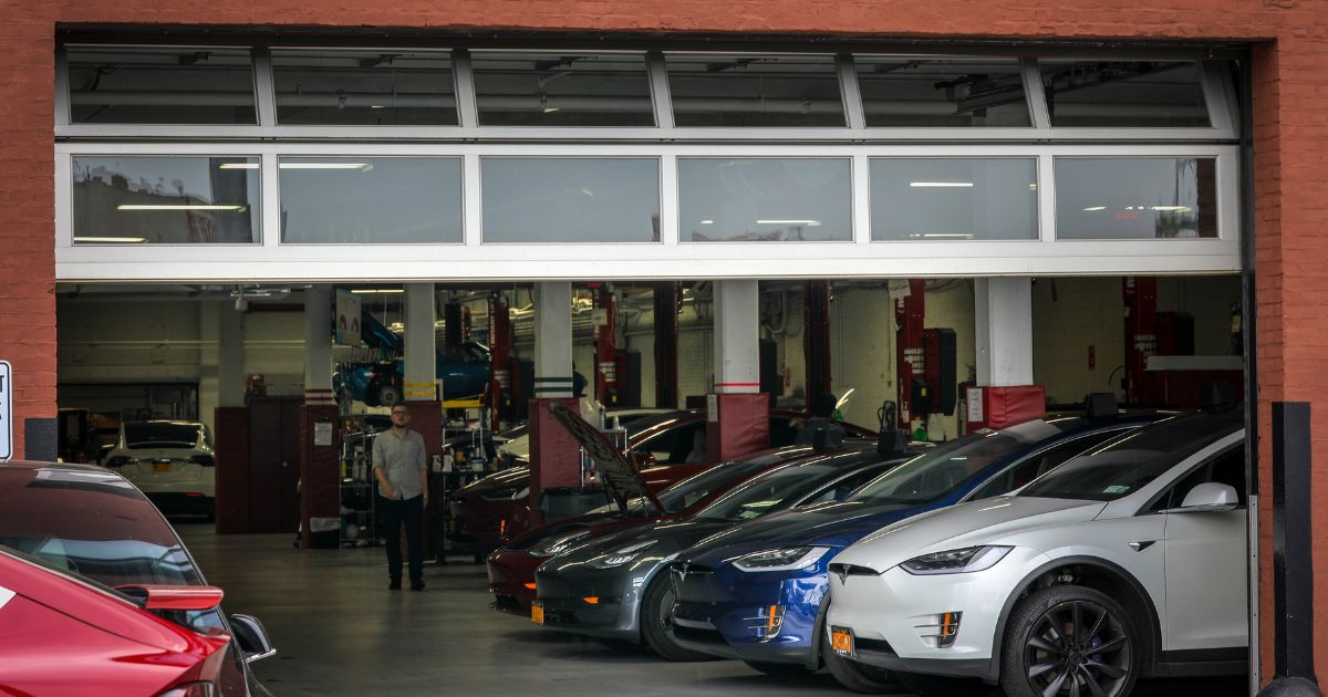 Tesla cars sit inside the service garage at a Tesla dealership in Brooklyn, New York Clty, on Aug. 7, 2018.