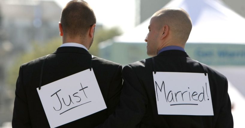 A same-sex couple walk arm in arm after they were married at San Francisco City Hall June 17, 2008, in San Francisco, California.