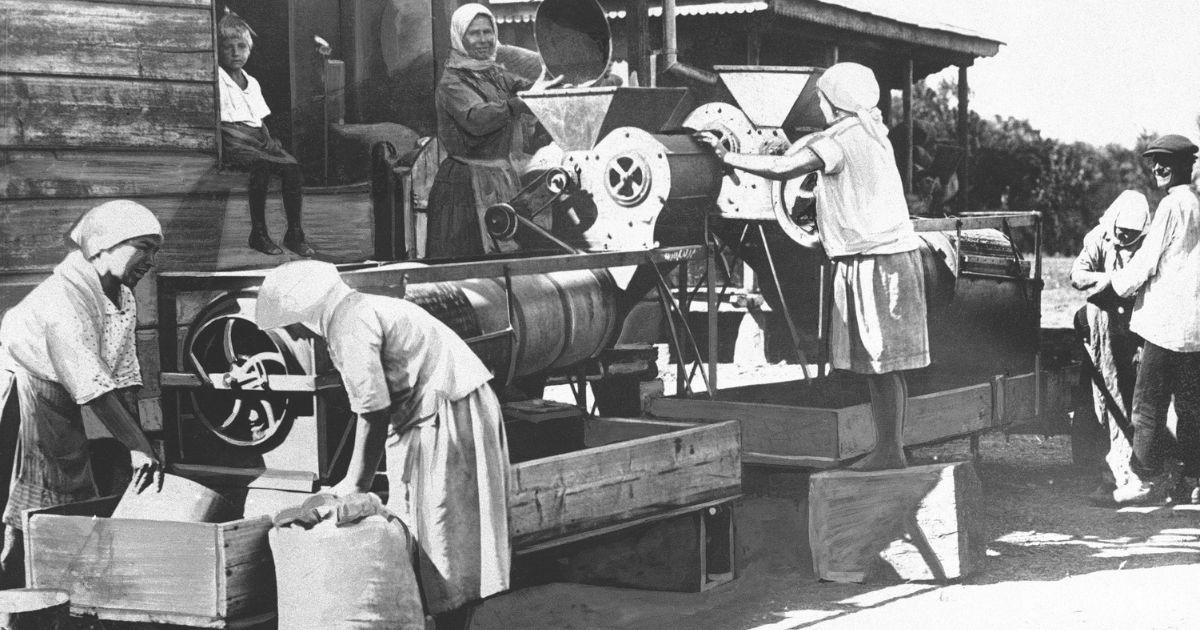 Wives of field workers operate a separator on a collective farm in the North Caucasus on Nov. 12, 1930.
