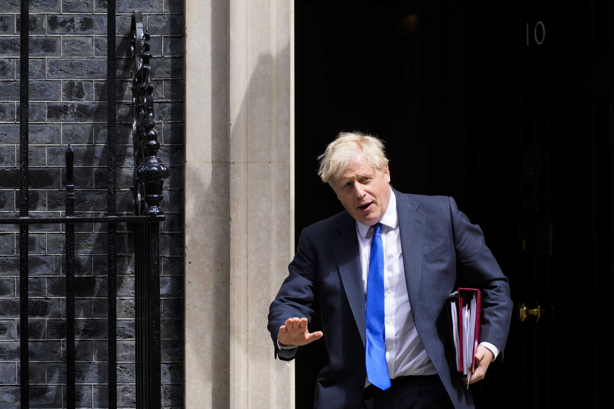 British Prime Minister Boris Johnson leaves 10 Downing Street in London Wednesday. Johnson stepped down as head of the Conservative Party Thursday after his government was rocked by the resignation of 50 top ministers.