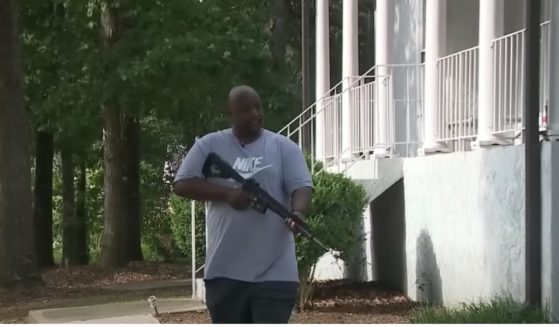 An armed veteran defends his home from invasion.