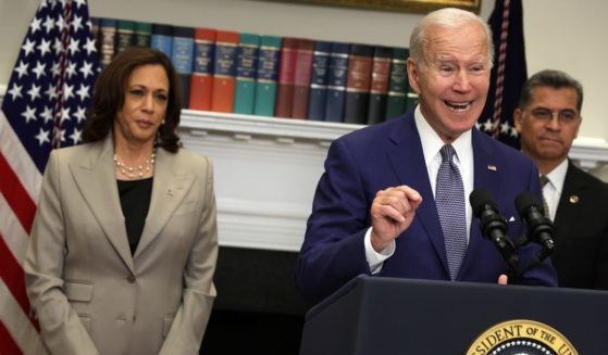 Vice President Kamala Harris, left, and Health and Human Services Secretary Xavier Becerra, right, appeared at times to struggle to keep straight faces as President Joe Biden bumbled his way through remarks about abortion at the White House Friday.