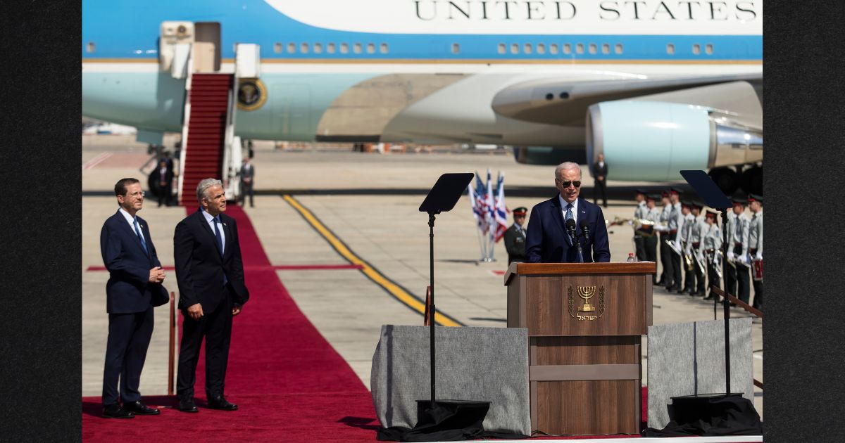 President Joe Biden speaks during the welcome ceremony as Israeli Prime Minister Yair Lapid and Israeli President Isaac Herzog listen during Biden's visit to Israel July 13 in Lod, Israel. Ahead of the visit, a U.S. Secret Service agent was sent home after a scuffle outside a bar in Jerusalem.
