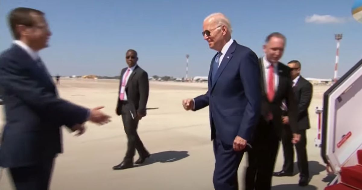President Joe Biden moves to fist bump Israeli President Isaac Herzog, who had extended his hand for a shake, on Wednesday near Tel Aviv.