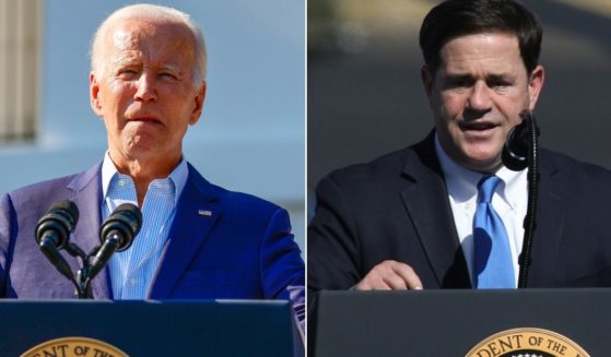 President Joe Biden's Justice Department has filed suit against Arizona for passing a law requiring proof of citizenship to vote in a federal election. Arizona Gov. Doug Ducey, right, said the bill represents "a balanced approach that honors Arizona’s history of making voting accessible without sacrificing security in our elections."