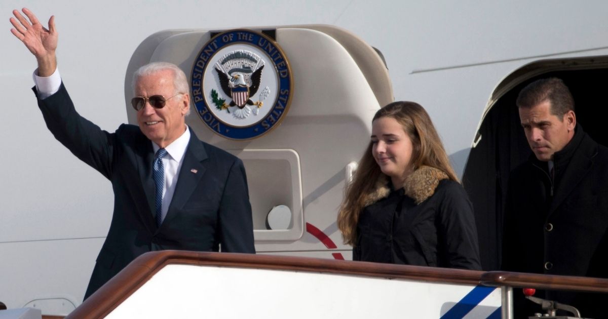 Then-Vice President Joe Biden walks out of Air Force Two in Beijing, China, with his granddaughter Finnegan Biden and son Hunter Biden in this file photo from Dec.4, 2013.