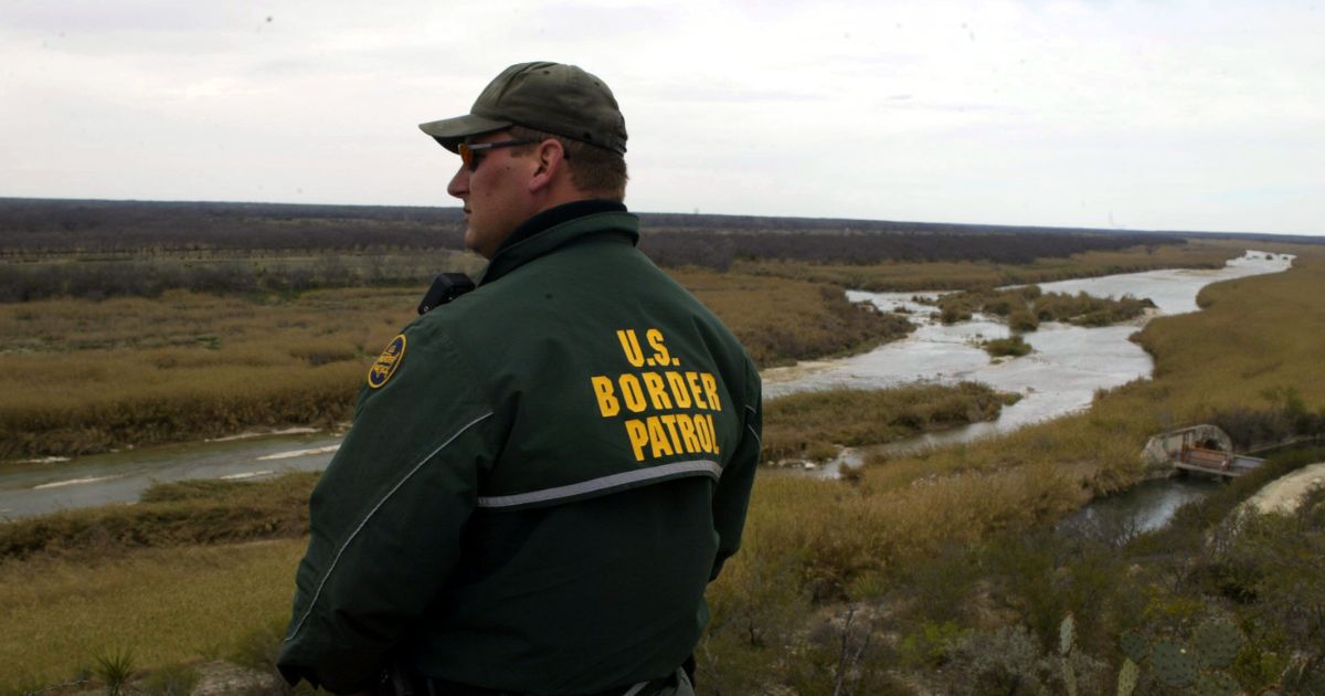 A U.S. Border Patrol agent scans the Eagle Pass area for illegal traffic.