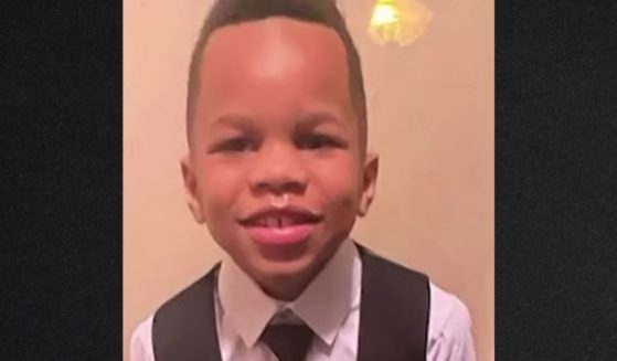 A 7-year-old boy's body was found in a washing machine in his family's garage.