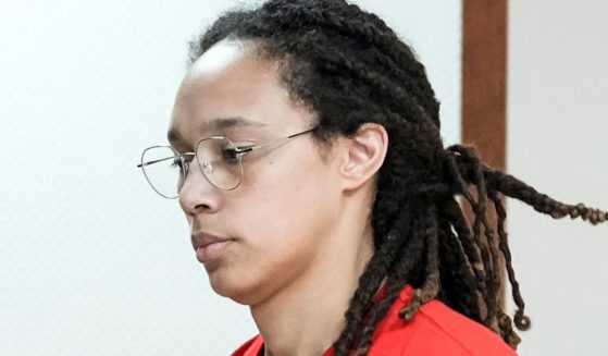 WNBA star Brittney Griner is escorted to a courtroom for a hearing in Khimki, Russia, just outside Moscow, on Thursday.