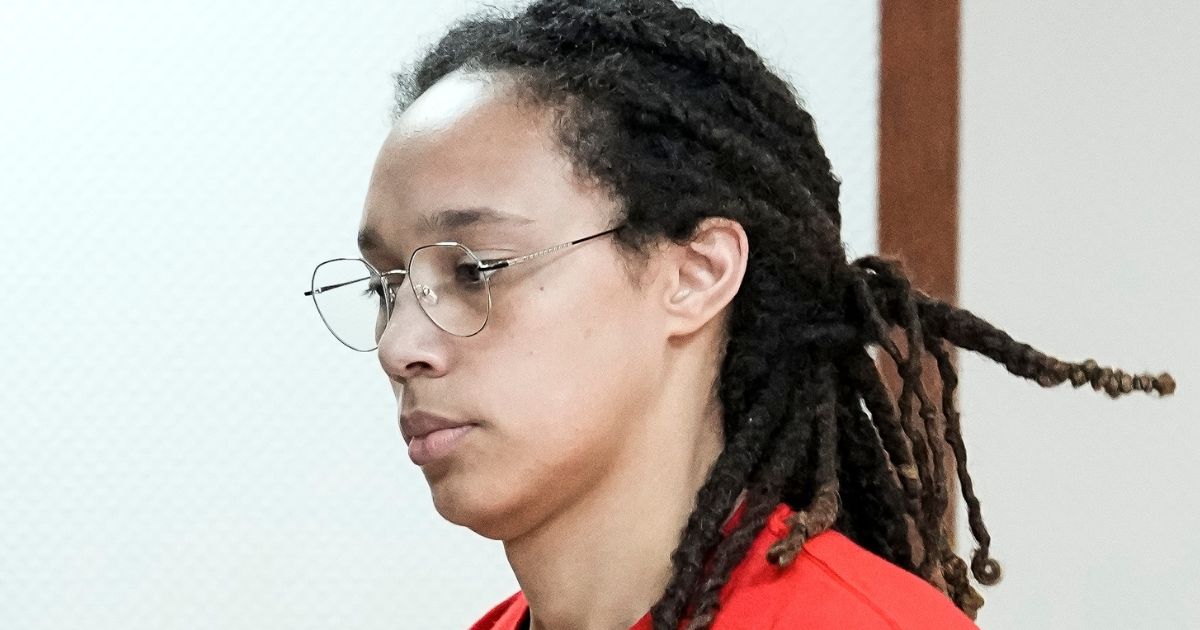 WNBA star Brittney Griner is escorted to a courtroom for a hearing in Khimki, Russia, just outside Moscow, on Thursday.