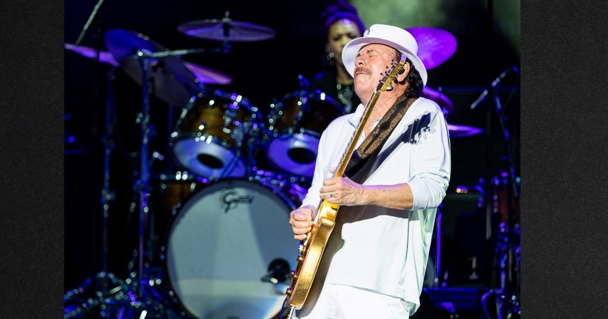 Carlos Santana performs with Earth, Wind & Fire at Pine Knob Music Theatre Tuesday in Clarkston, Michigan. The 74-year-old rock legend collapsed onstage during the performance. Representatives said he was suffering from heat exhaustion and dehydration.