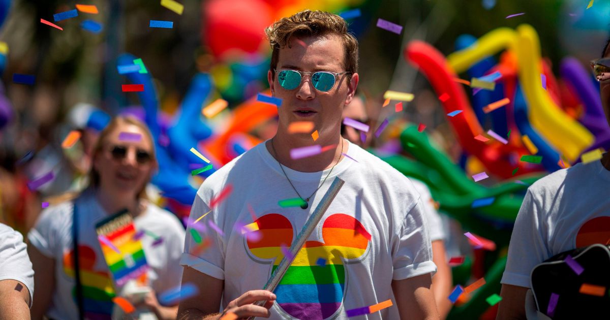 People from the Walt Disney Co. participate in the annual Los Angeles "Pride" Parade in West Hollywood, California, on June 9, 2019.
