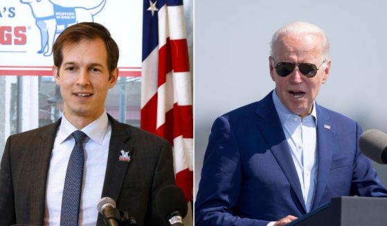 While introducing members of Congress during a speech in Massachusetts on Wednesday, President Joe Biden, right, mispronounced Rep. Jake Auchincloss' name.