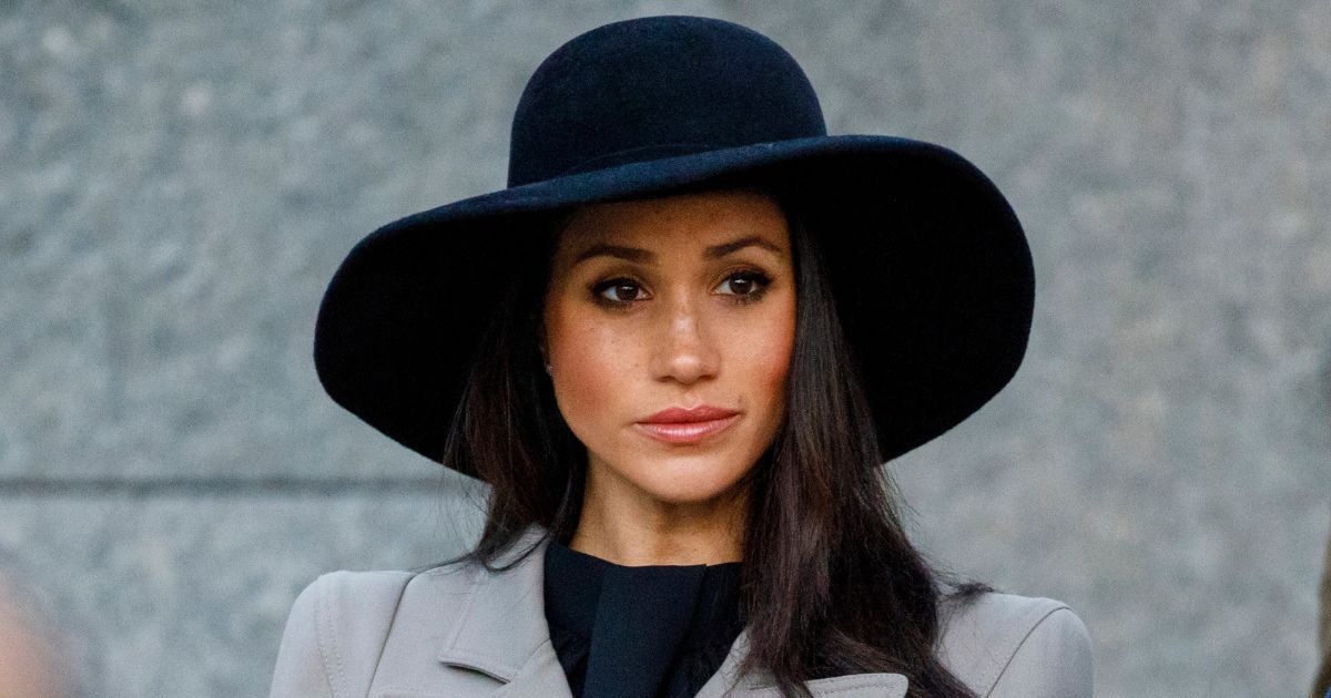 Meghan Markle has a solemn facial expression while attending an Anzac Day dawn service at Hyde Park Corner in London on April 25, 2018.