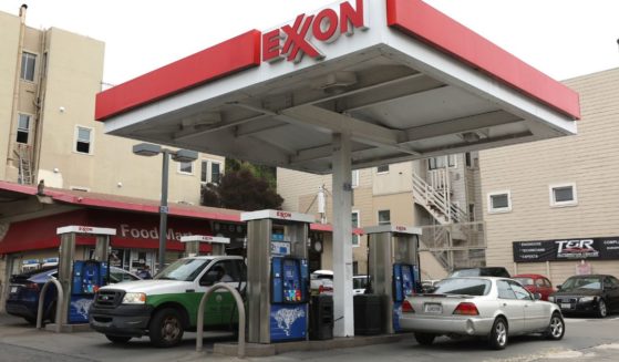 Customers fill up at an Exxon gas station on July 5 in San Francisco, California.