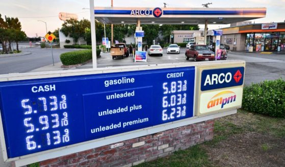 High gas prices are seen on a sign at an ARCO station in Rosemead, California, on Tuesday.