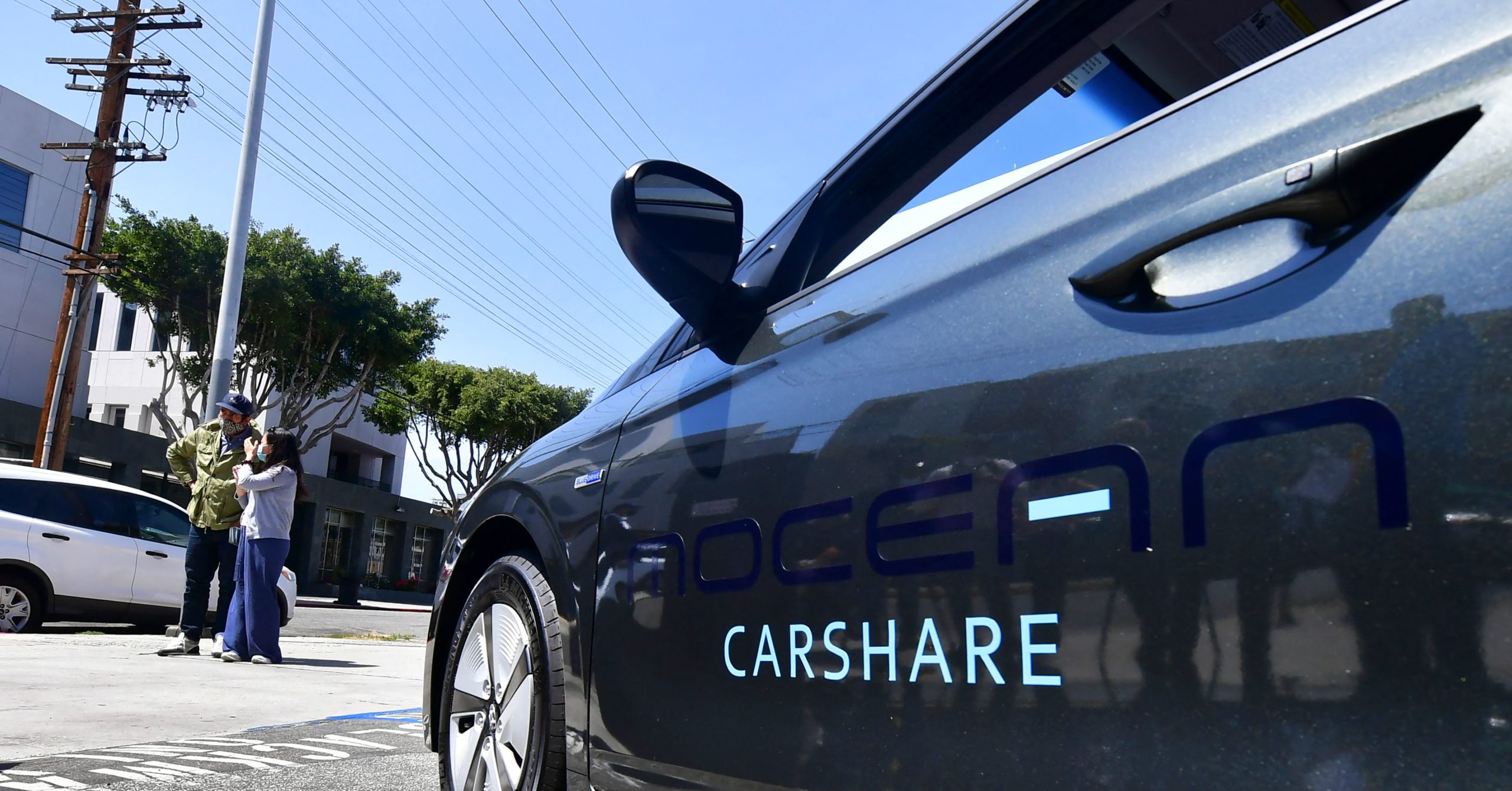 A vehicle from the Mocean car-share service is seen in Los Angeles, California, in April of 2021. World Economic Forum leader Klaus Schwab said this week he believes individual car ownership is wasteful and should be abolished in favor of car-sharing services.
