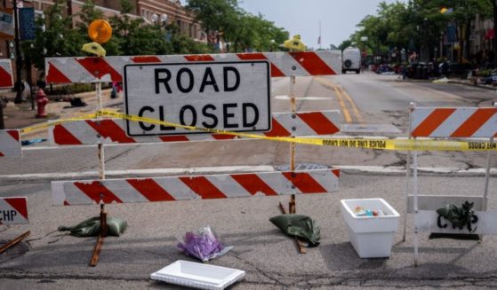 On Tuesday, flowers were laid outside of scene of the Fourth of July parade shooting in Highland Park, Illinois.