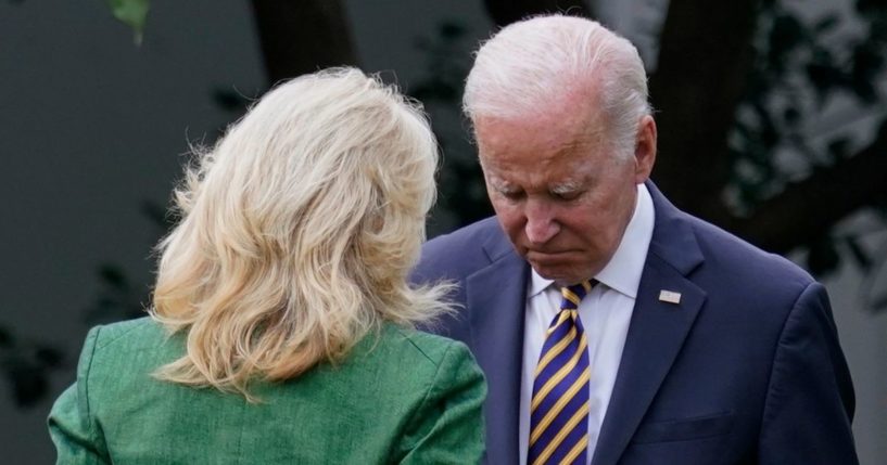President Joe Biden speaks with first lady Jill Biden before boarding Marine One in Washington on Wednesday.