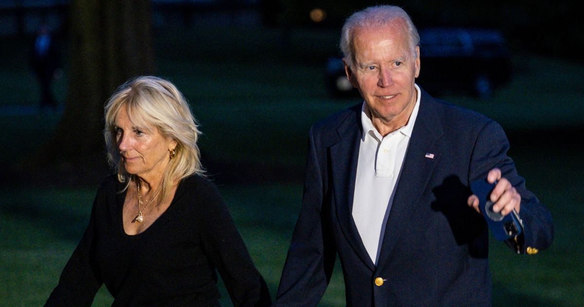 President Joe Biden and first lady Jill Biden walk from Marine One to the White House in Washington on June 20 after a long weekend in Rehoboth Beach, Delaware.