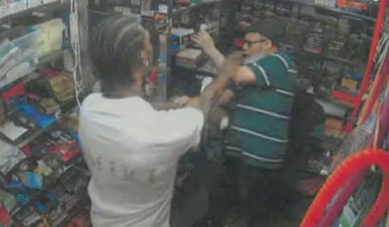 Jose Alba, right, was charged with second degree murder after being attacked in the bodega in New York City where he worked and defending himself by fatally stabbing his attacker with a knife. The Manhattan DA dropped the charges against him on Tuesday.