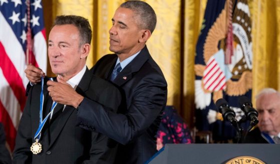 Former President Barack Obama honors singer Bruce Springsteen with the Presidential Medal of Freedom at a White House ceremony in Washington, D.C., on Nov. 16, 2016.