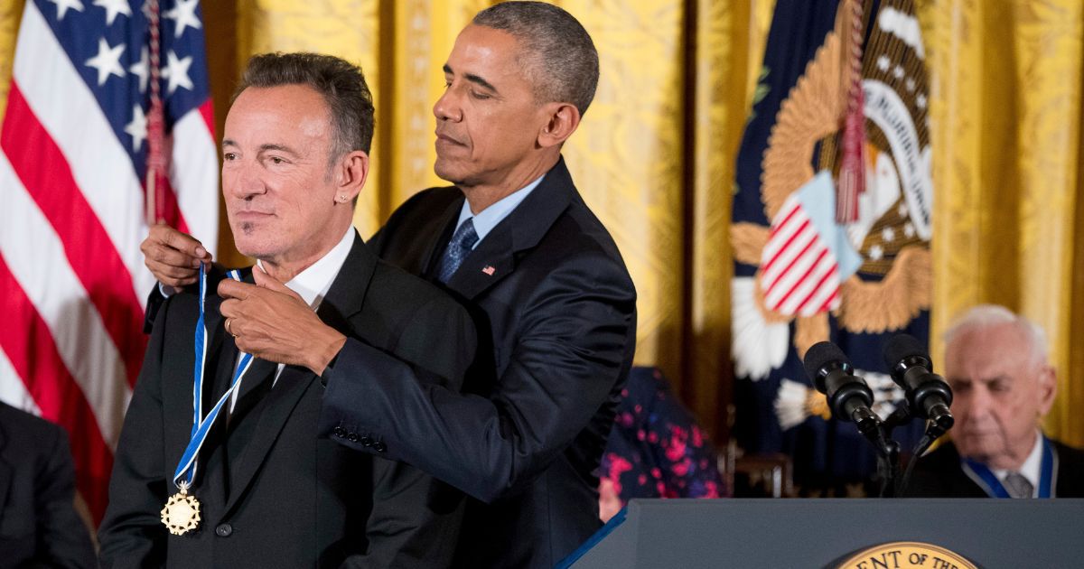 Former President Barack Obama honors singer Bruce Springsteen with the Presidential Medal of Freedom at a White House ceremony in Washington, D.C., on Nov. 16, 2016.
