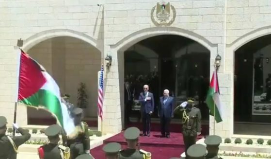President Joe Biden stands before the Palestinian Authority's official band as they hail him with their rendition of the Star-Spangled Banner on Friday.
