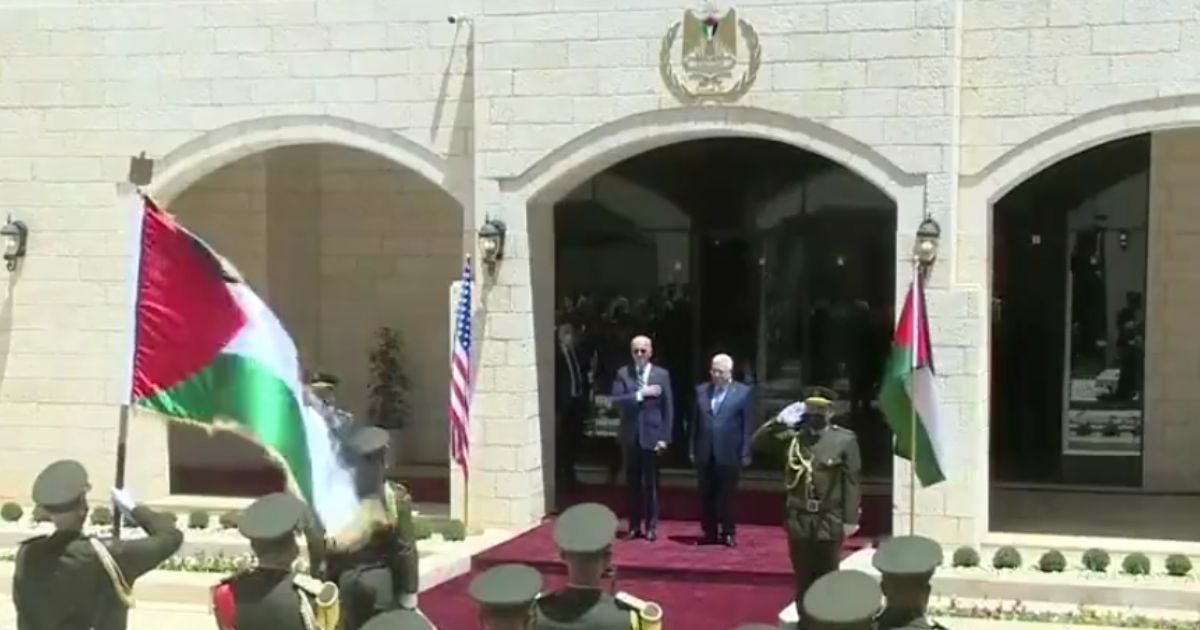 President Joe Biden stands before the Palestinian Authority's official band as they hail him with their rendition of the Star-Spangled Banner on Friday.