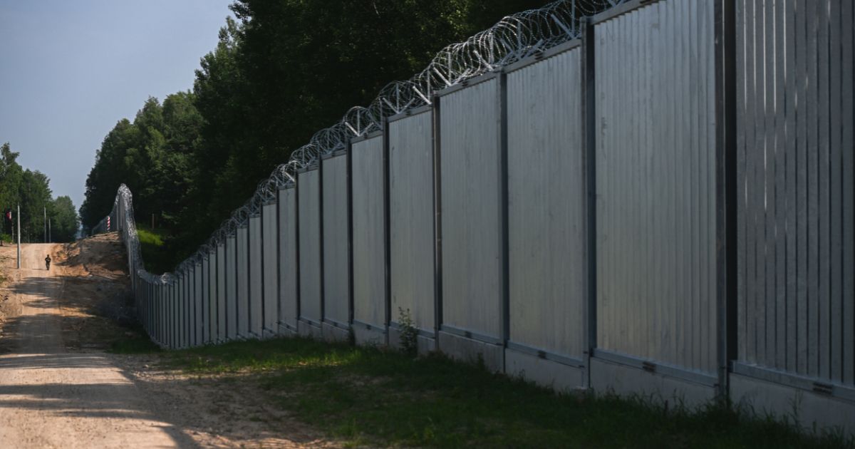 The metal border wall in Kuznica, Poland, across from Belarus, is seen June 30.