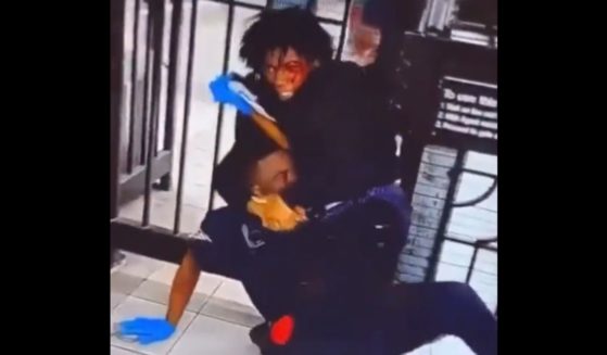 A police officer is put in a chokehold by a teenager in a New York subway brawl.