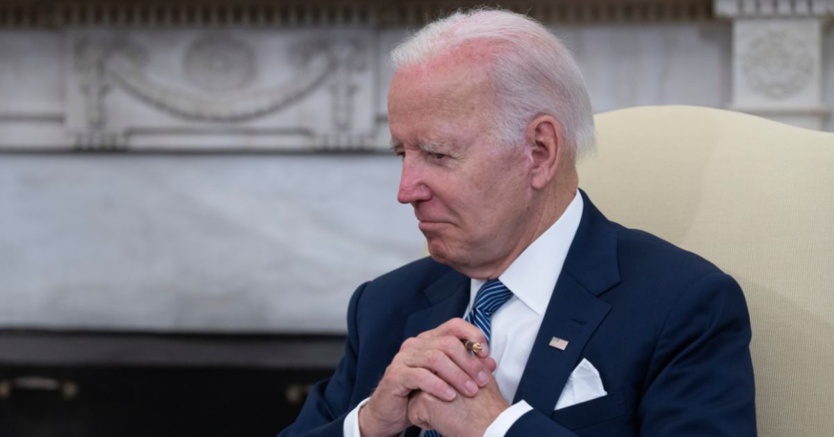 President Joe Biden listens to Mexican President Andrés Manuel López Obrador during their meeting in the Oval Office at the White House on July 12.
